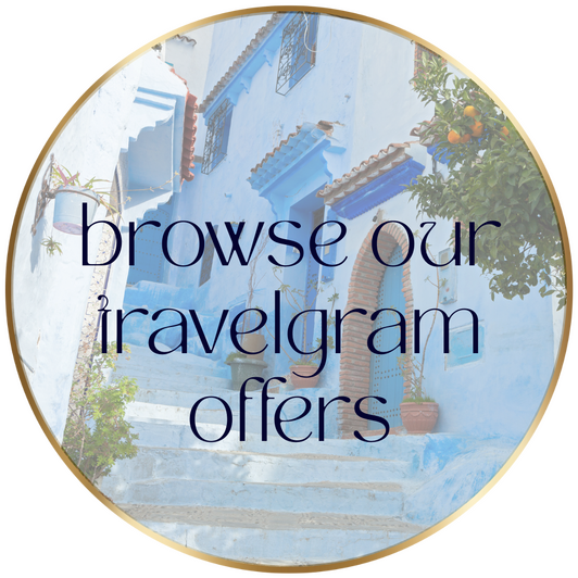 browse our travelgram offers - Glow Well Travel blue Moroccan village background with text overlay, inviting you to browse our travelgram offers at Glow Well Travel